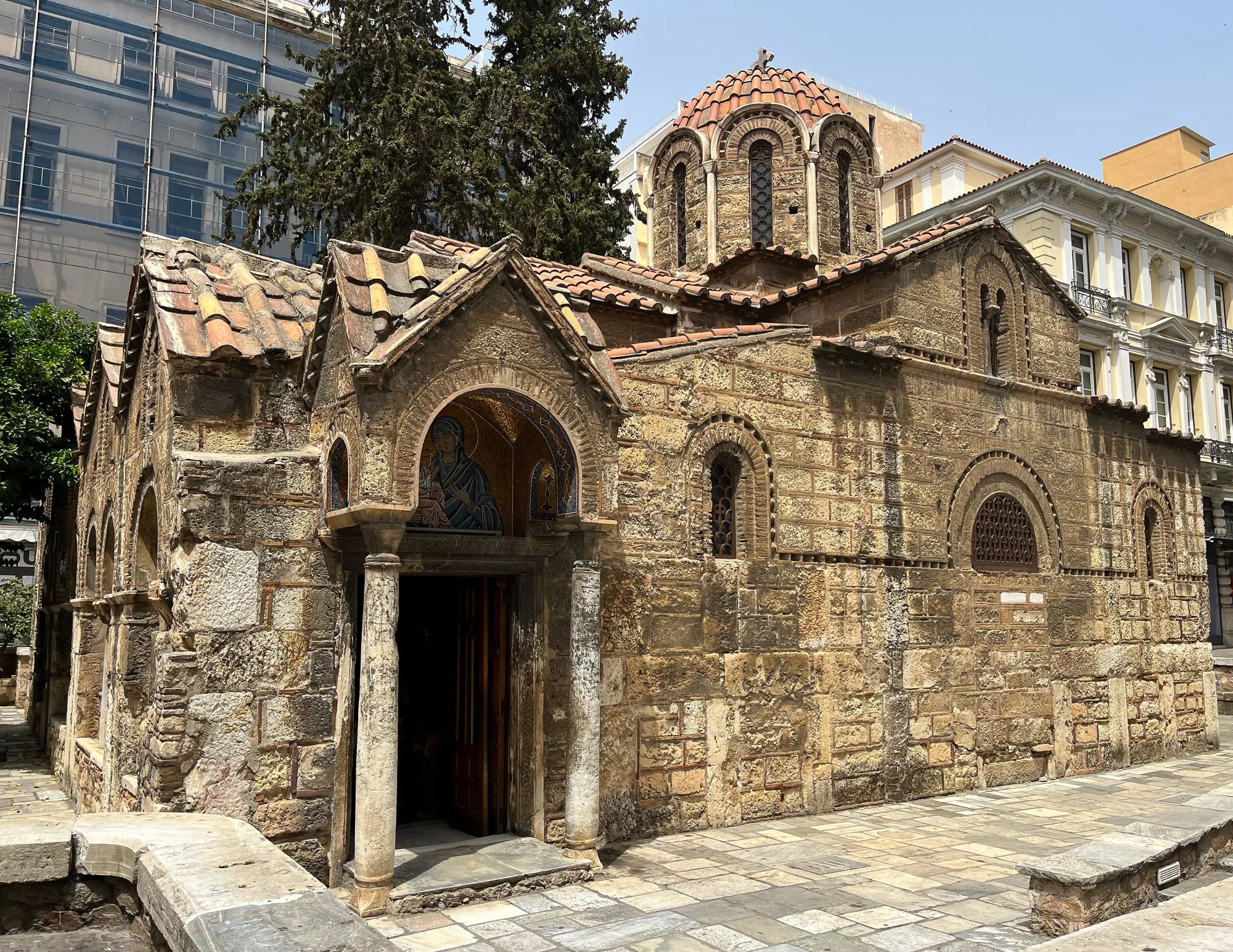 Stone church in the middle of the pedestrian pathway