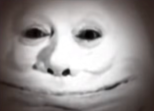 A black and white image of Humpty Dumpty, from a 1933 adaptation of Alice in Wonderland