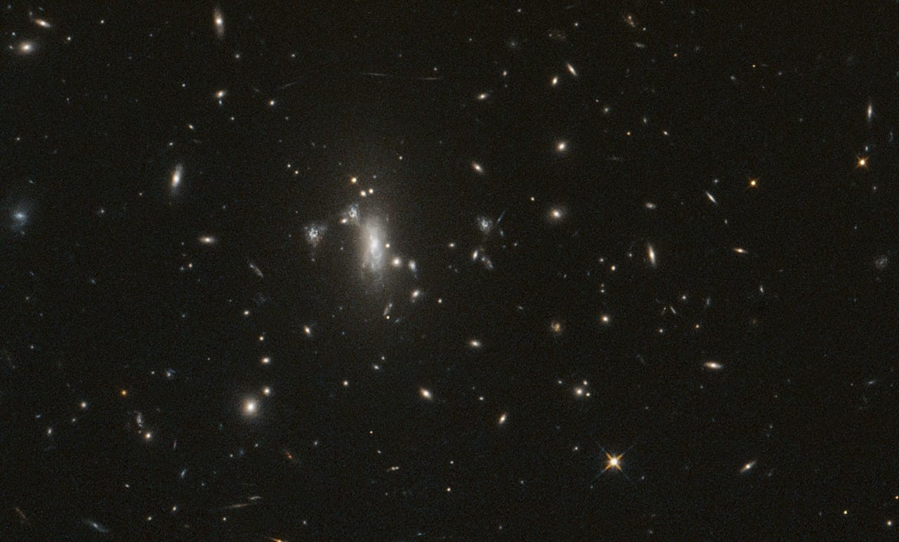 A Hubble Space Telescope image shows galaxies in the MACS J0417 cluster field.