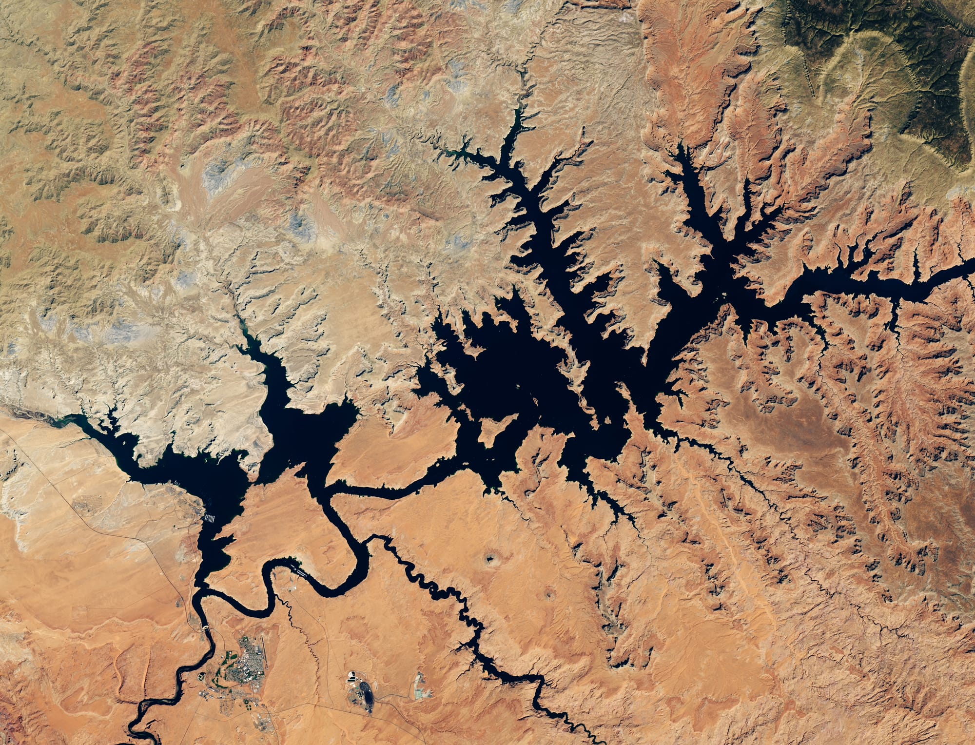 A Landsat 8 view shows Lake Powell with fuller dark water channels in September 2017.