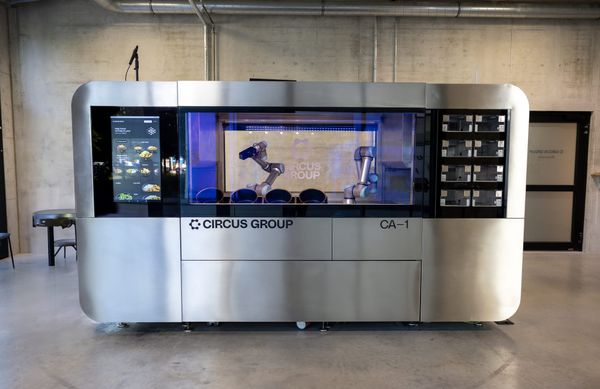 Circus Group CA-1 autonomous meal-production robot with robotic arms visible inside the machine.