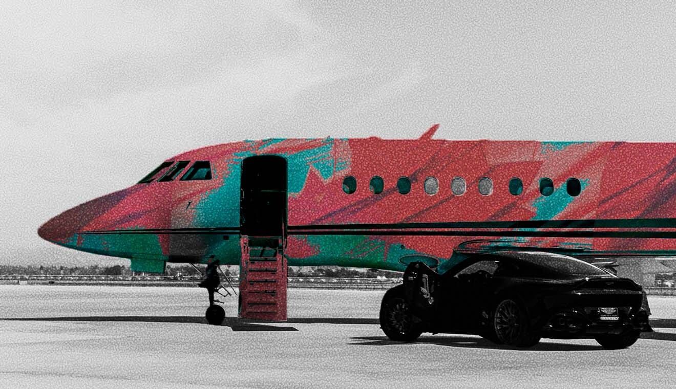 A sports car in front of a private jet