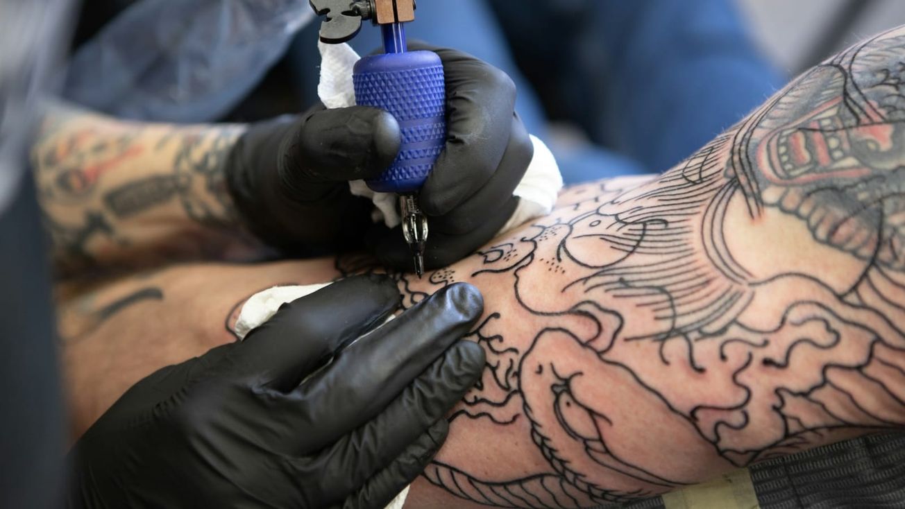 Former Altrincham tattoo studio owner banned