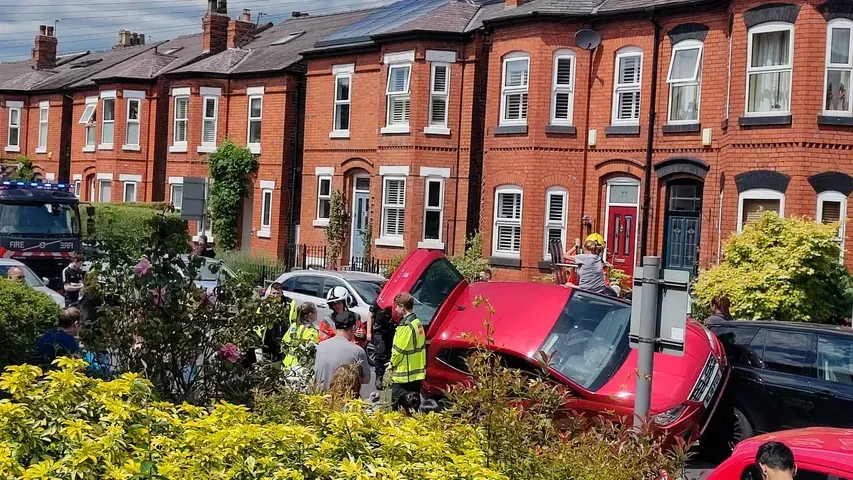 Woman arrested after car ploughs into three parked vehicles in Altrincham