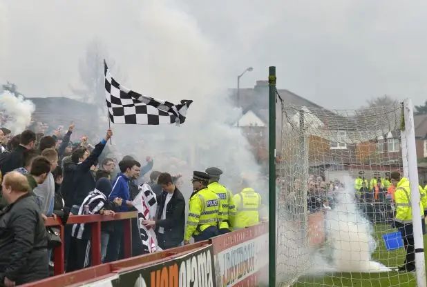 FA to investigate Grimsby fans after Moss Lane smoke bombs