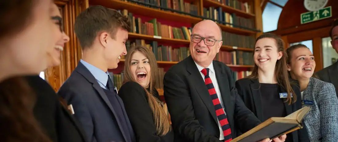 Altrincham-born arts boss is guest of honour on first return to school in 50 years