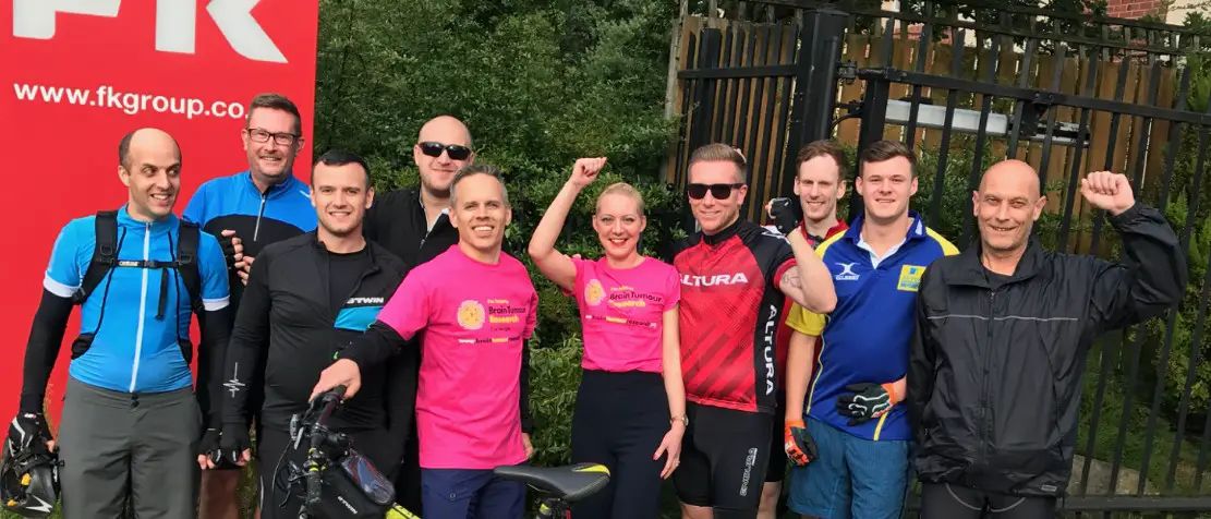 Altrincham staff complete 112-mile charity ride in support of colleague’s wife