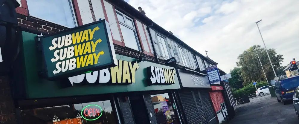 Knife-wielding robbers escape with cash after holding up Subway in Timperley