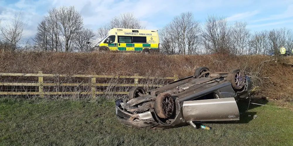 Driver and passenger have “very lucky escape” after car lands upside down in a ditch close to Bowdon junction