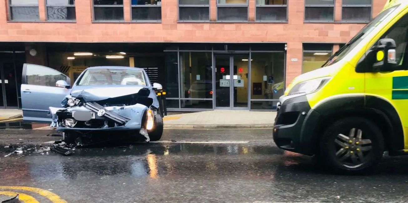 Man in his 90s in hospital after car collides with bus in Altrincham town centre