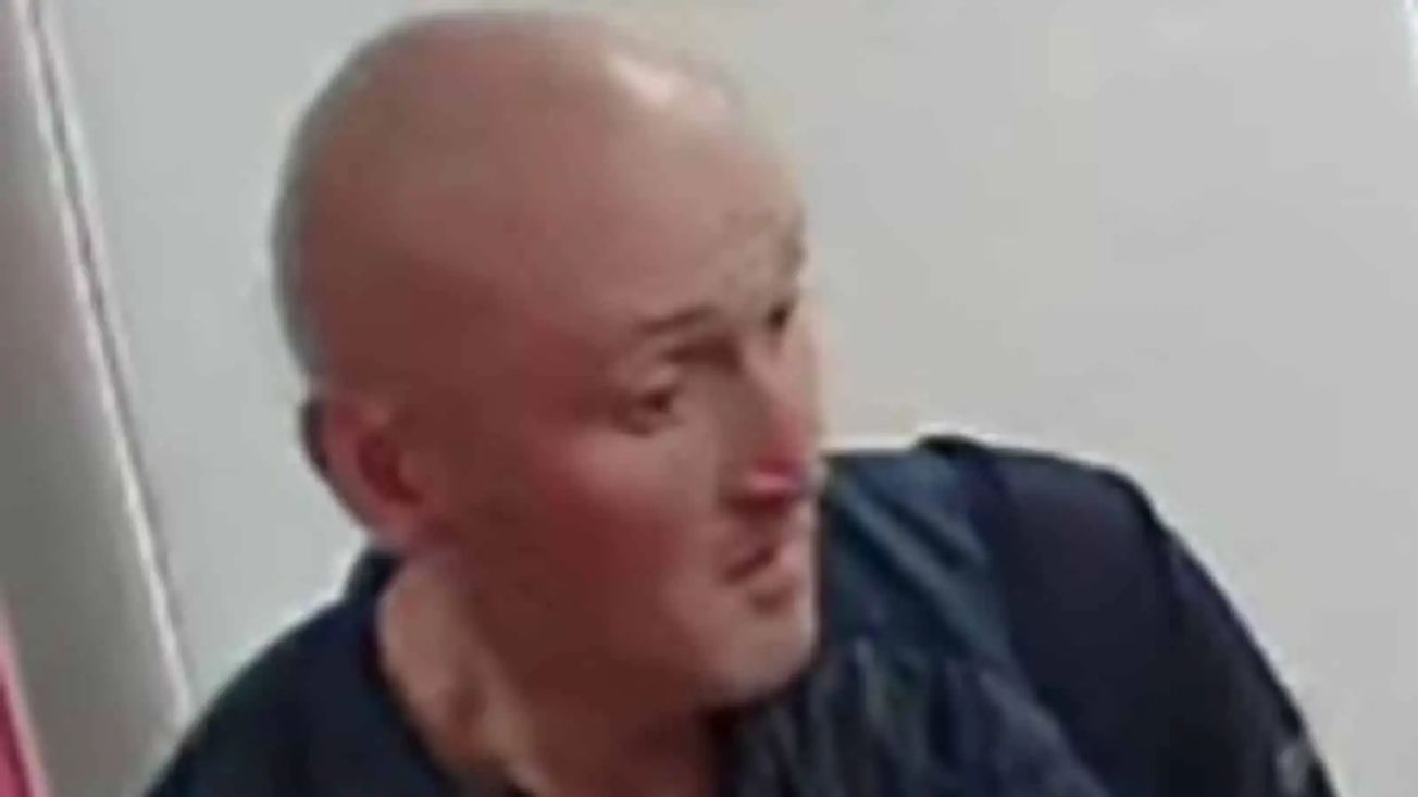 Police want to speak to this man in connection with an Altrincham office burglary