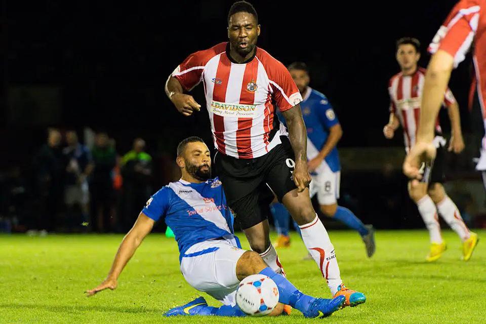  Michael Rankine is taken down by a mistimed challenge