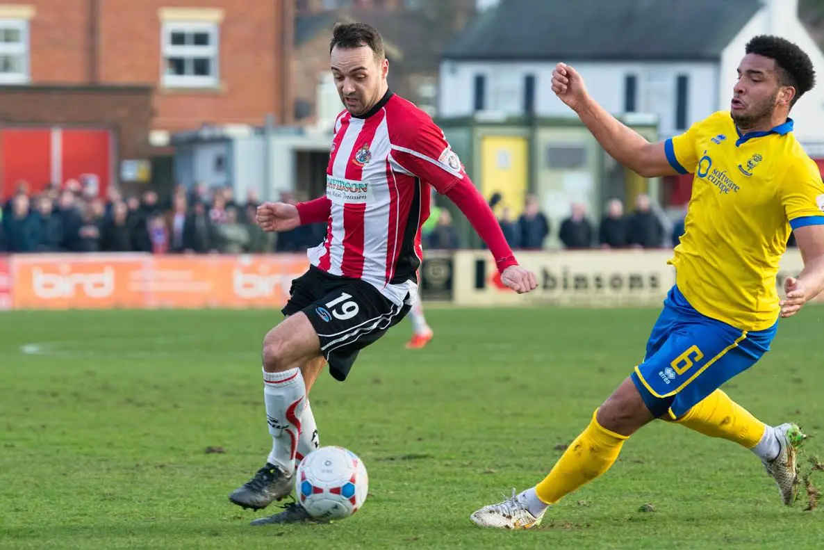 Ryan Crowther turns his defender