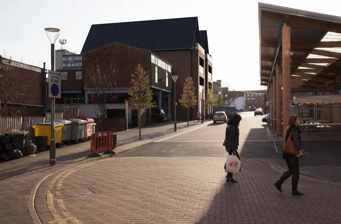 Looking towards the scheme down Central Way, opposite the lower marketplace