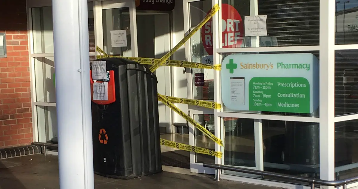 The damaged front door at Sainsbury's Altrincham