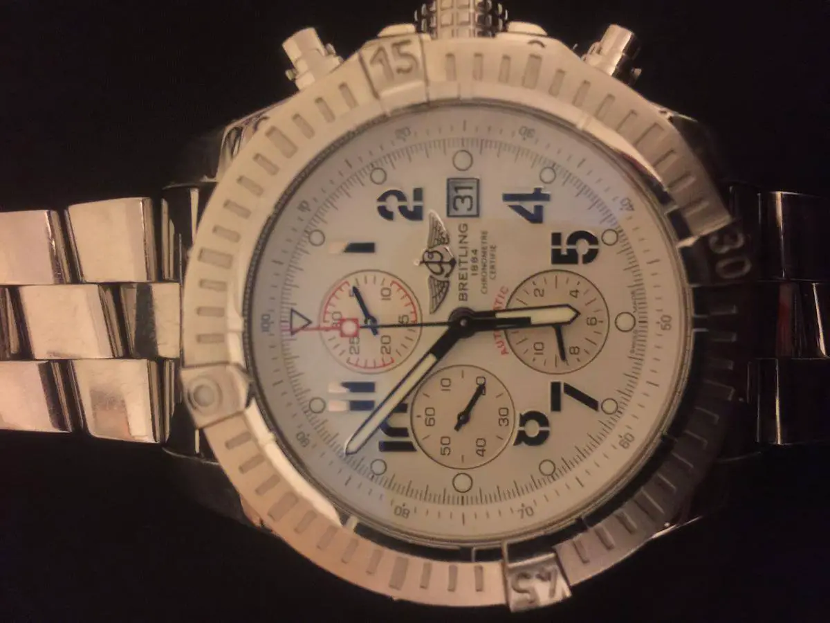 The Breitling watch stolen, and below, the type of laptop case that was taken