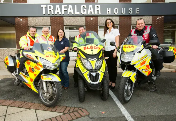 Marketing director Rebecca Donohue with the heads of the Scotland, Nottinghamshire and Manchester Blood Bikes groups outside their Altrincham offices at Trafalgar House