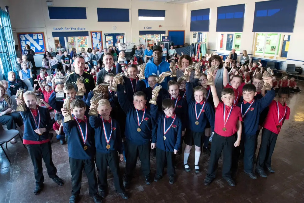  Pictured: Back row - Sam Sheridan, Mr Bird, Emile Heskey, Miss Johnston and Mrs Lyde. Middle row - Rosie Crossthwaite, Mason Lawley, Katie Beech, Jade Buckley-Ratcliffe, Chloe Houghton, Ella Brownhill, Summer Cunliffe, Lucy Seddon, Caide Atherton and Connor Wright. Front Row - Taylor Thomas, Louis Ray, Joshua Reeves-Dempster, Adam Heap, Emilia Crosby Sanne, Finley Hulse, Joel Page and Mohammed Elhassan