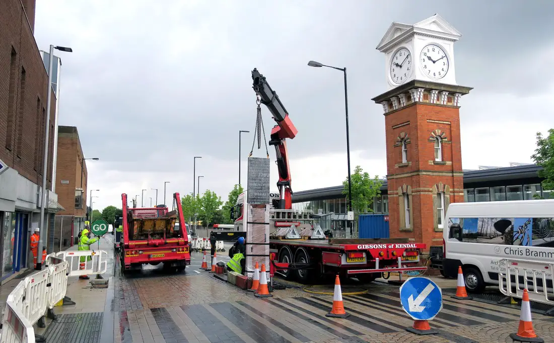The totem being lowered into place