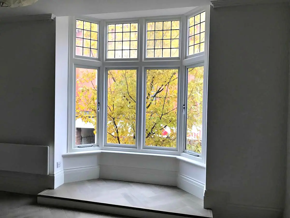 The bay windows look out on to Stamford New Road, in the heart of the town centre