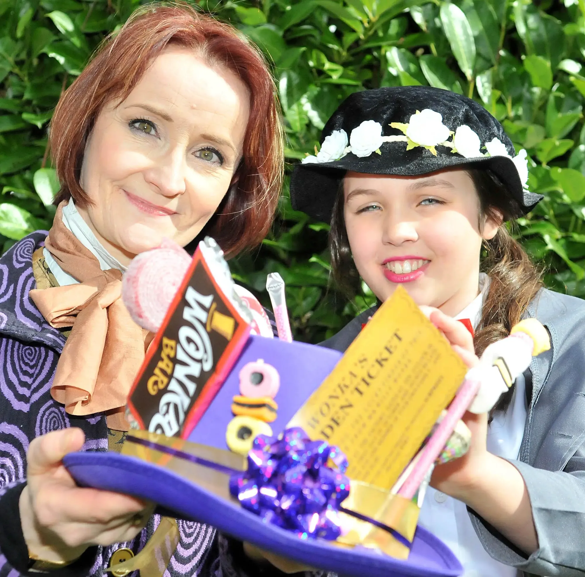 Loreto finance officer Helen Gill, as Willy Wonka, and Megan Gilliver, 11, from Sale, who is Mary Poppins