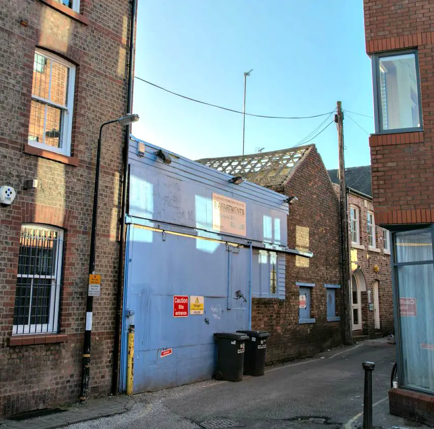 The Tannery at Goose Green - previously a disused garage (above) - has been completely transformed into 13 high-spec apartments