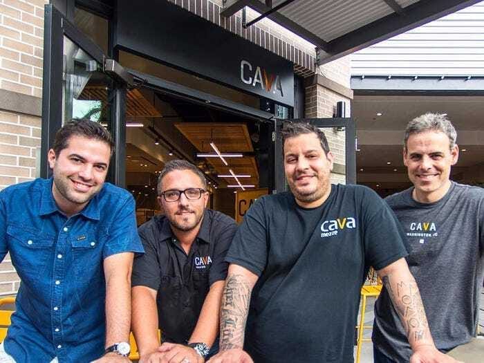 A group of men posing for a photo Description automatically generated