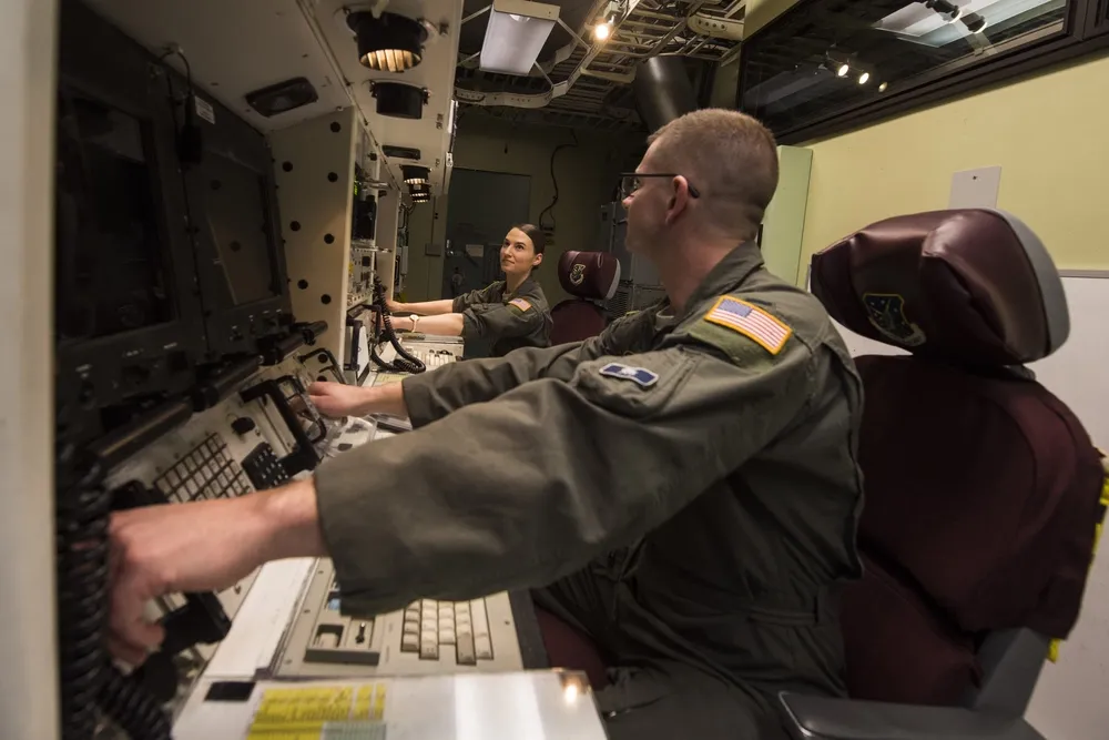 Interior of a Minuteman missile Launch Control Center capsule showing crew consoles and equipment