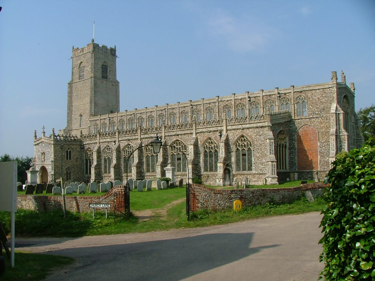 Holy Trinity Church, Blythburgh, Suffolk, England — site of the most famous recorded Black Shuck encounter in 1577, when a large canine entity reportedly entered the church during a storm, killing several congregants and scorching the door