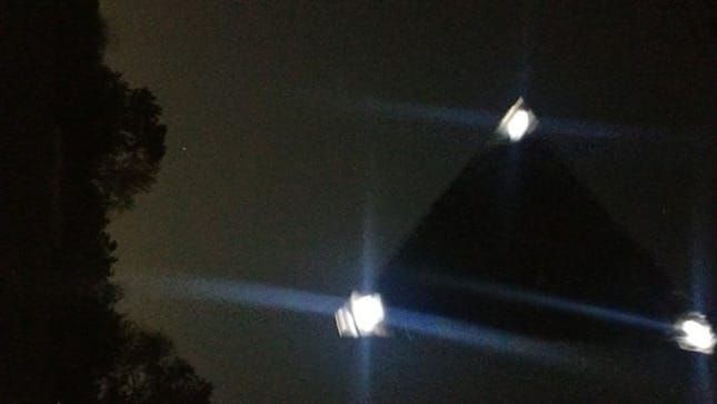 Silent Triangle Craft Hovers Over Car on Mississippi Highway