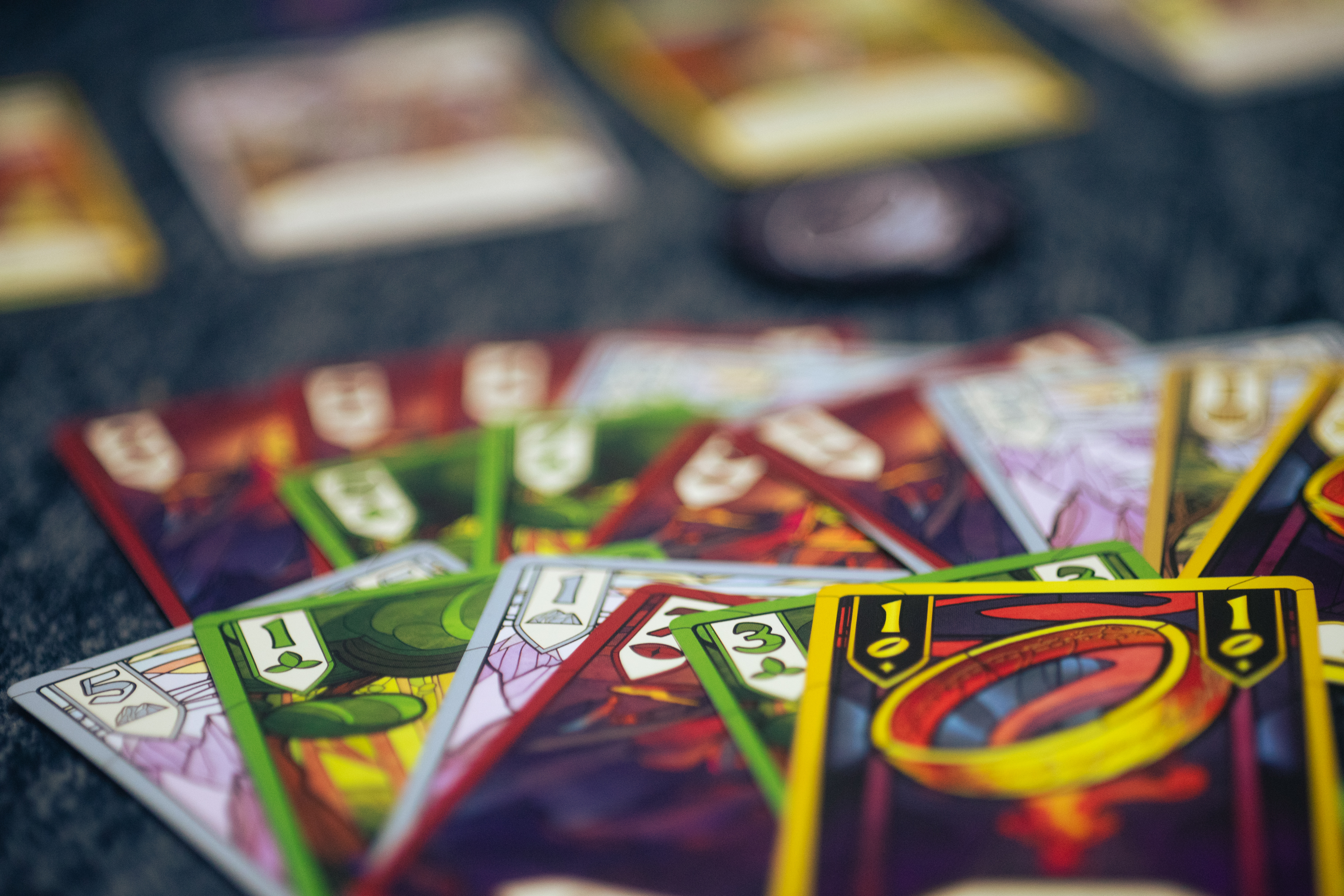 Cards from the game The Fellowship of the Ring: Trick-Taking Game laid on a flat surface.