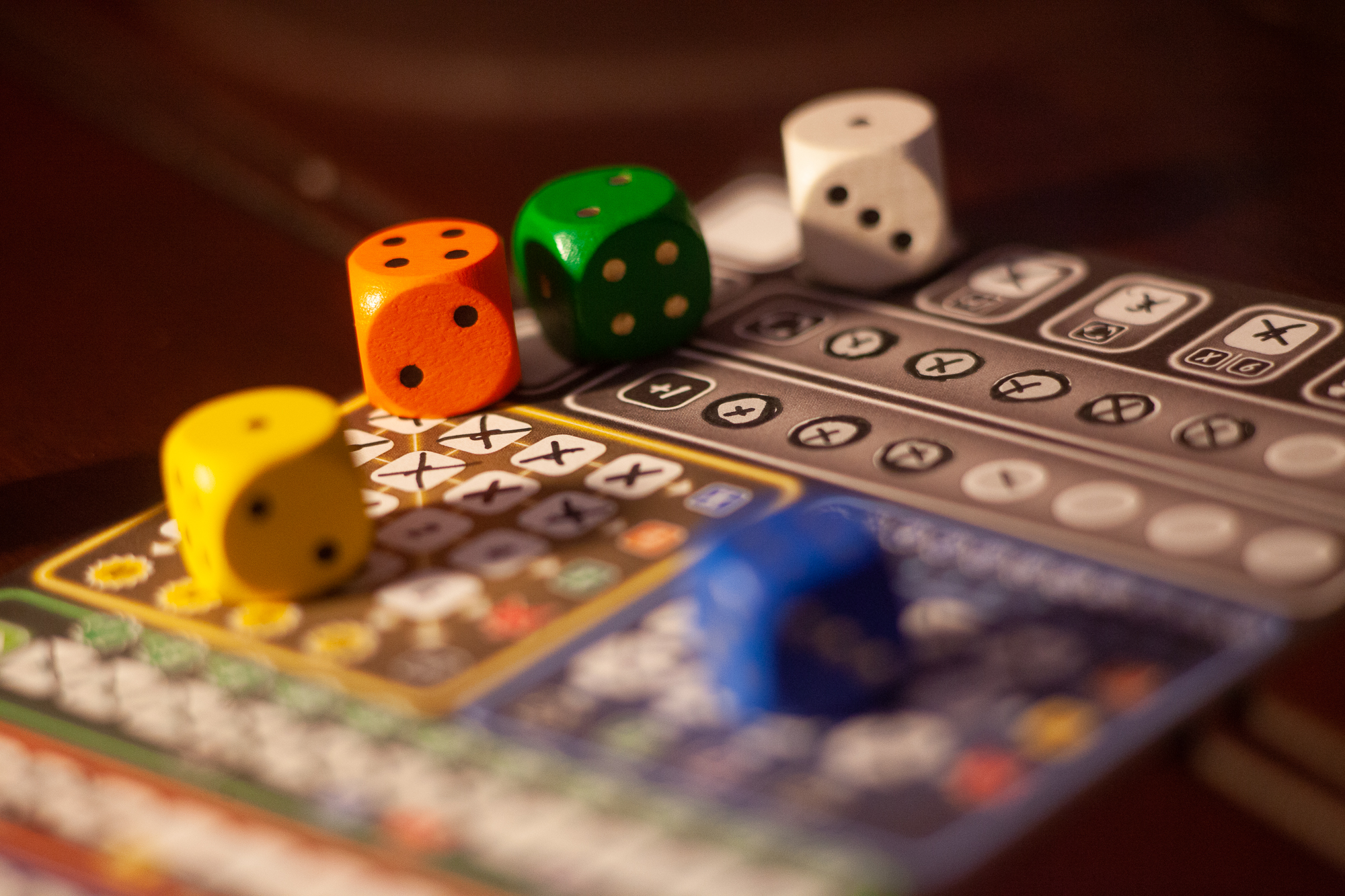 Dice from the game That's Pretty Clever on a player sheet.