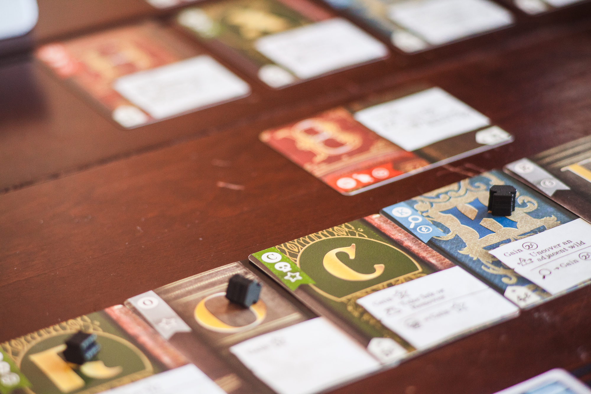 The card game Hardback on a table. Several letters are visible.