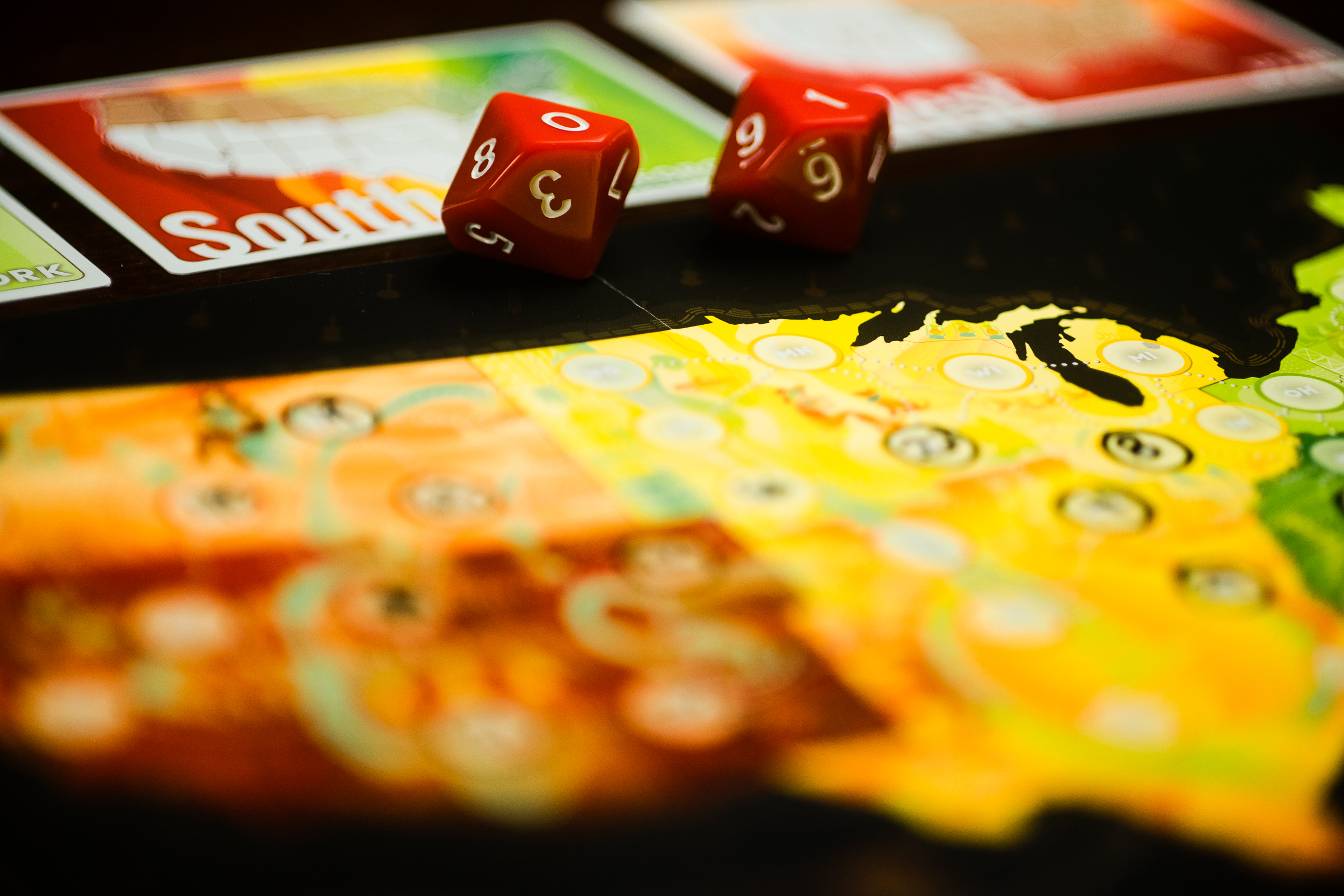 Dice and a player board from the game On Tour.