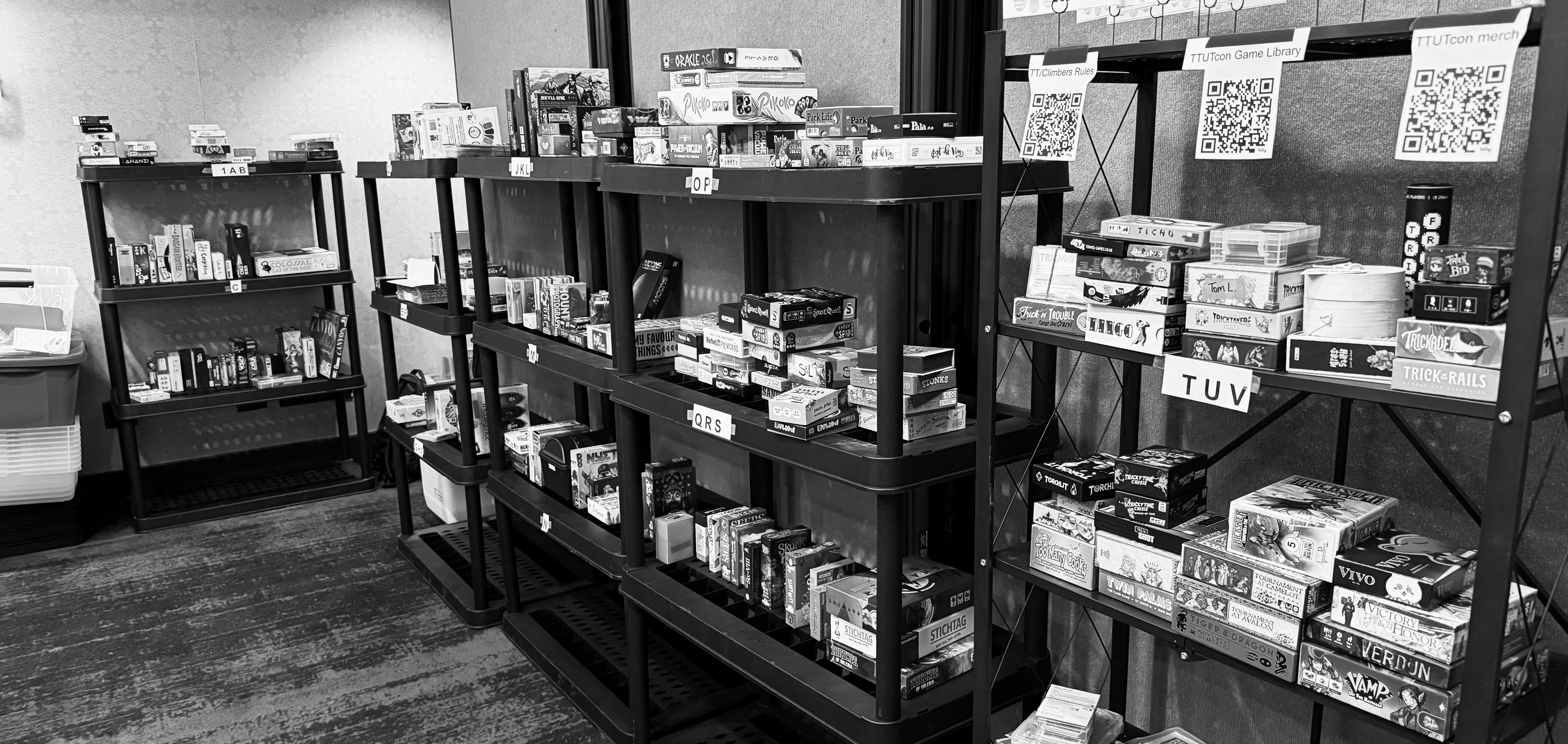 Games in boxes placed on shelves.