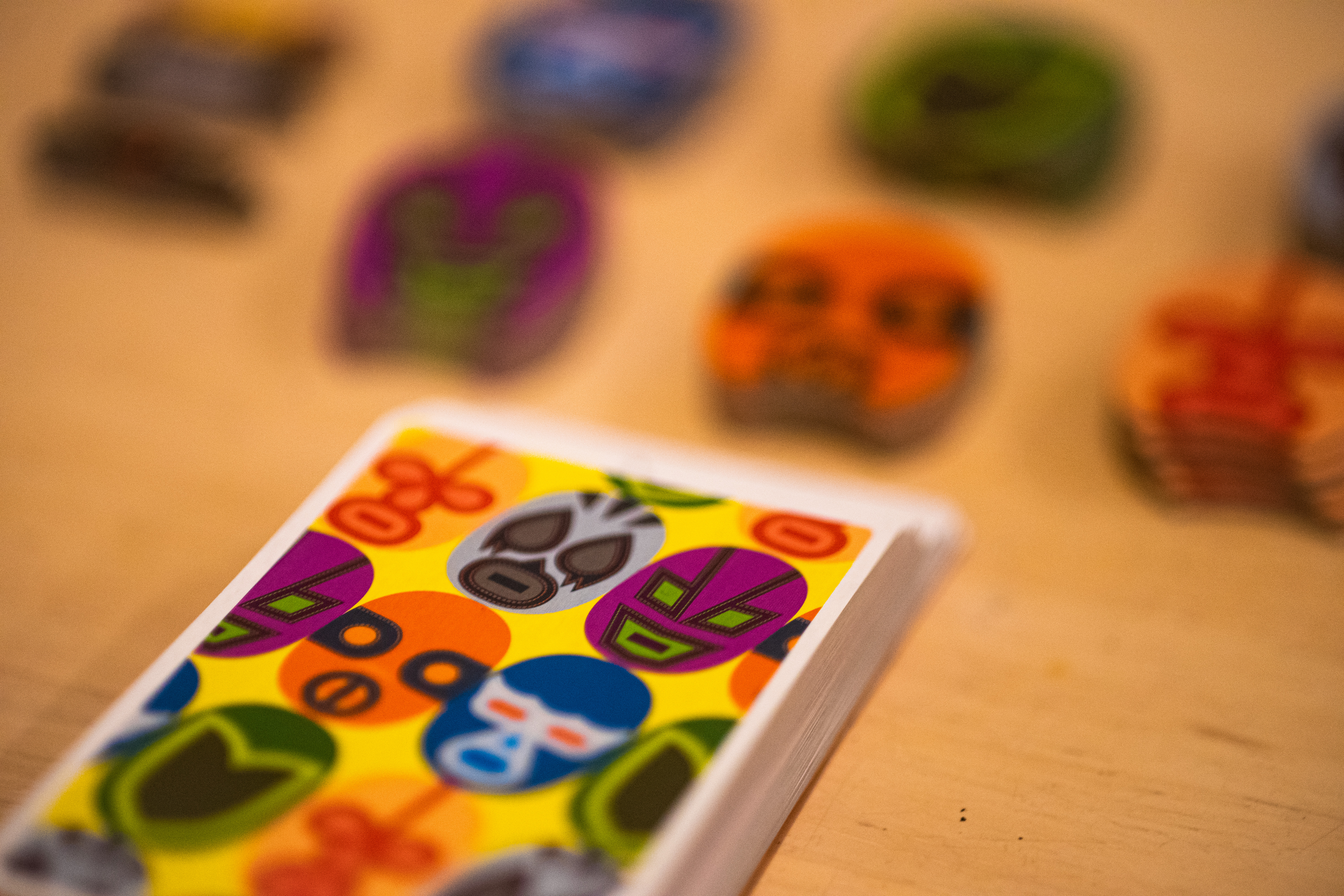 The card game Maskmen being played on a table.