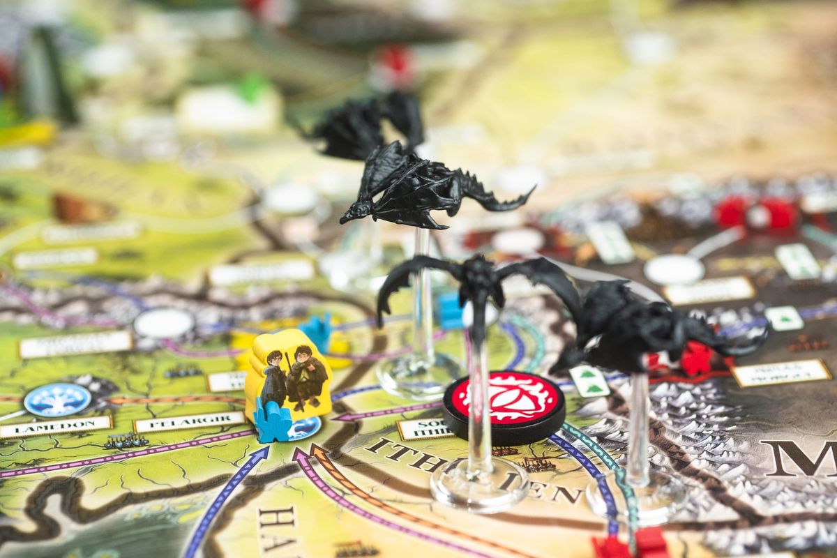 The Lord of the Rings: Fate of the Fellowship is pictured with Frodo and Sam standing near four Nazgûl.