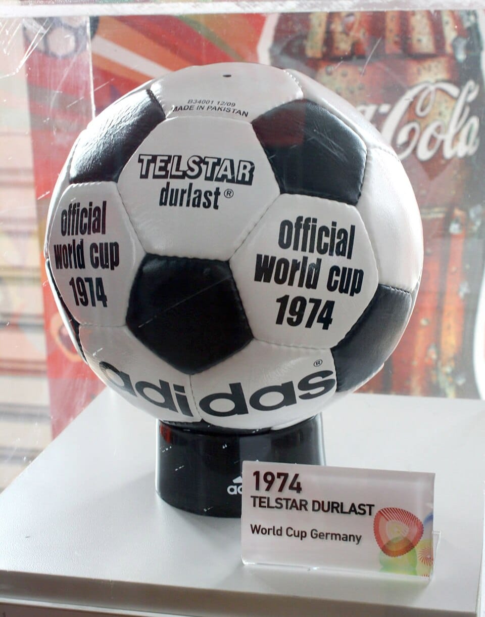 Photograph of an Adidas Telstar Durlast soccer ball with black pentagonal panels and white hexagonal panels, the official match ball of the 1974 FIFA World Cup.