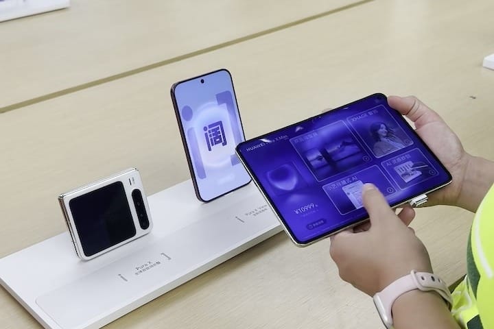 Foldable phones on a table at a Huawei store