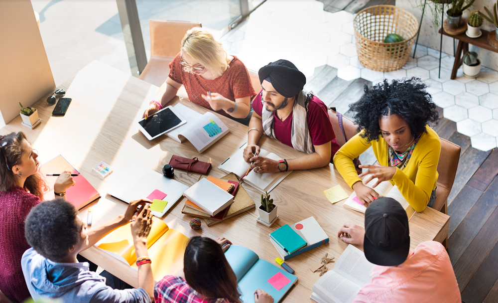 Stock image of a diverse team working