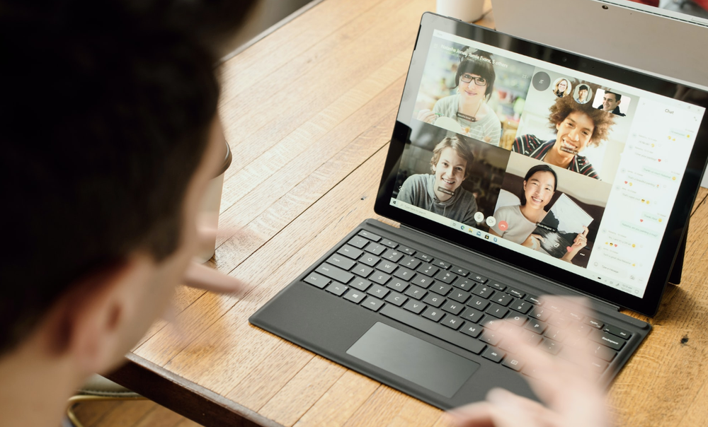 Person on a video call with four others