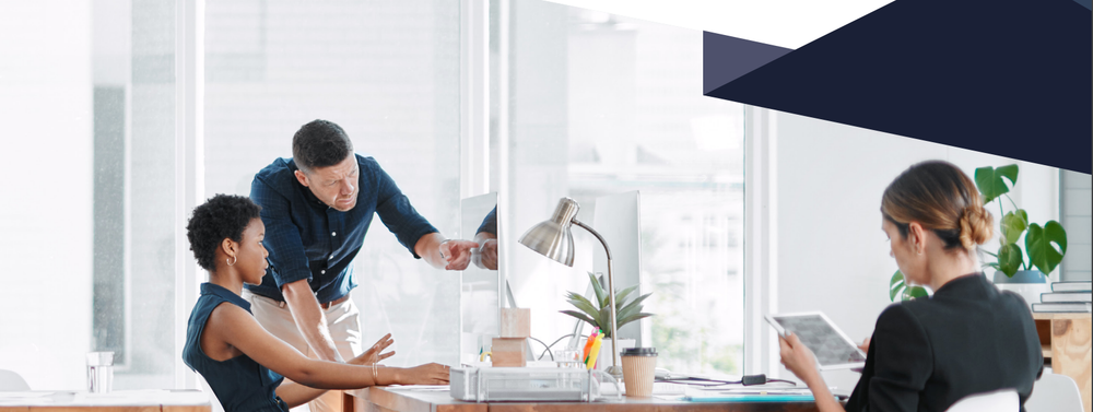 Three people working in an modern office