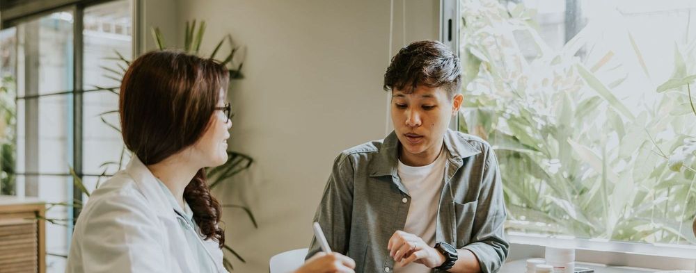 Two people talking at a table