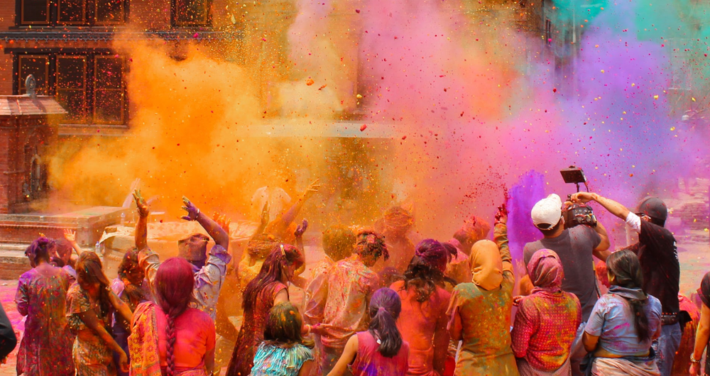 Group of people celebrating the festival of colors Holi which is very famous in Nepal and India