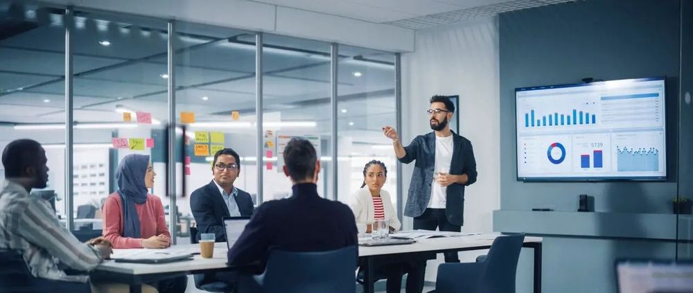 Inclusive leader Leads Business Meeting with Managers