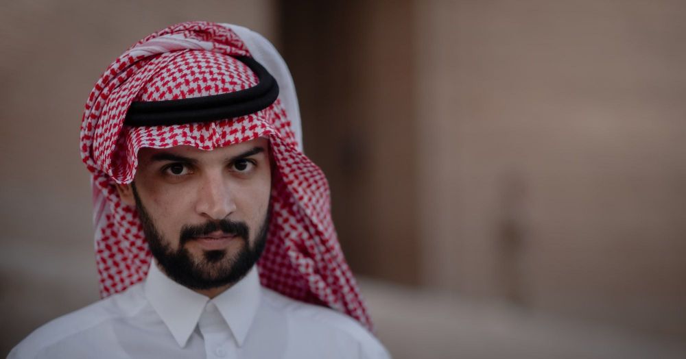 Arab man with red checkered head scarf