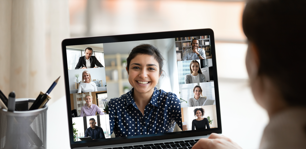 Video conference meeting screen displaying diverse professionals
