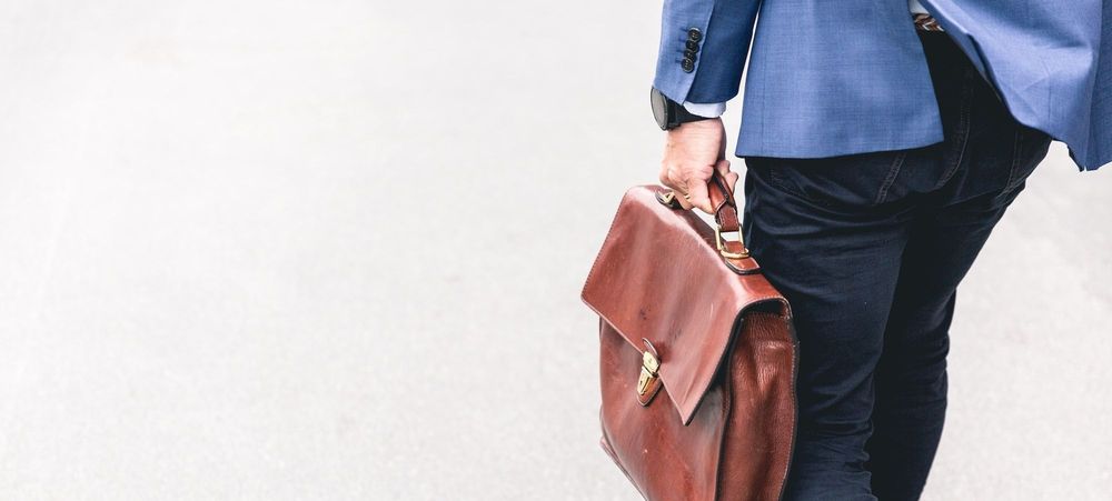 Person carrying briefcase to work