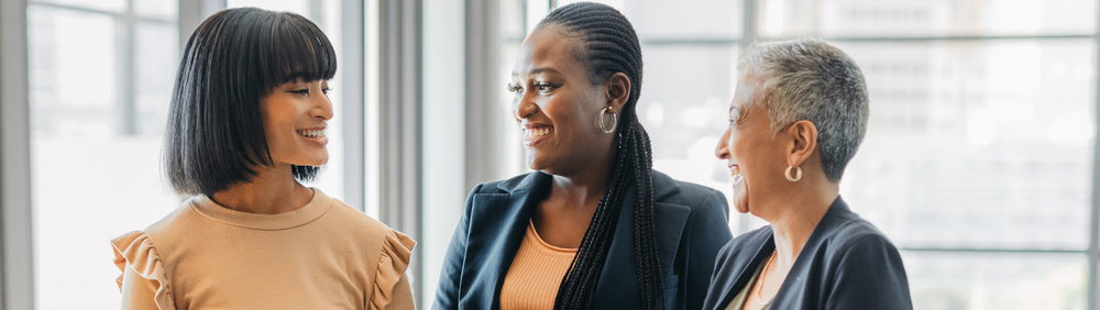 Three women of color in an office