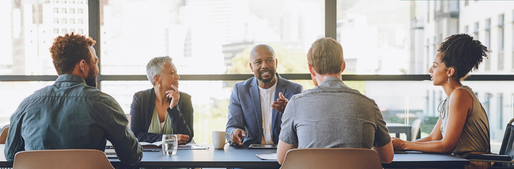 A diverse team uses inclusive communication to enhance collaboration